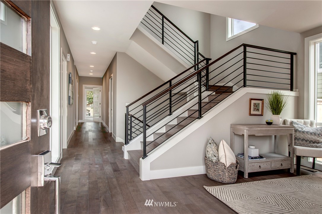 1002 North 30th Street Renton, WA 98056 - Photo 7 of 25 a view of entryway and hall with wooden floor