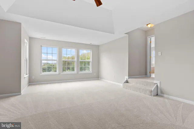 a bathroom with a tub sink and shower