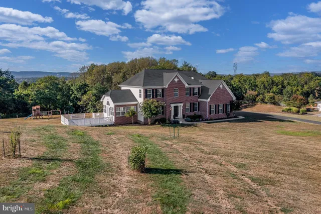 a aerial view of a house with a yard