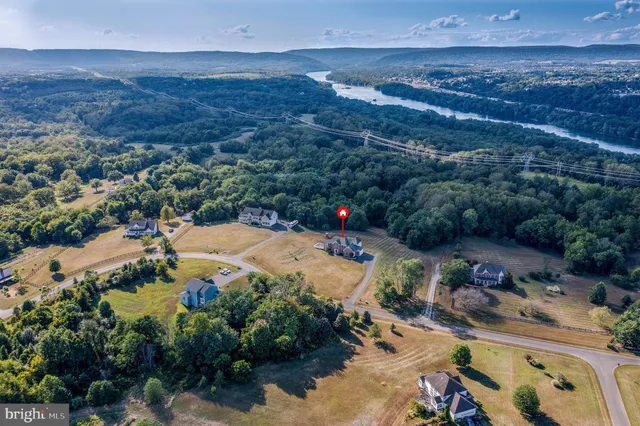 a view of a swimming pool with a yard