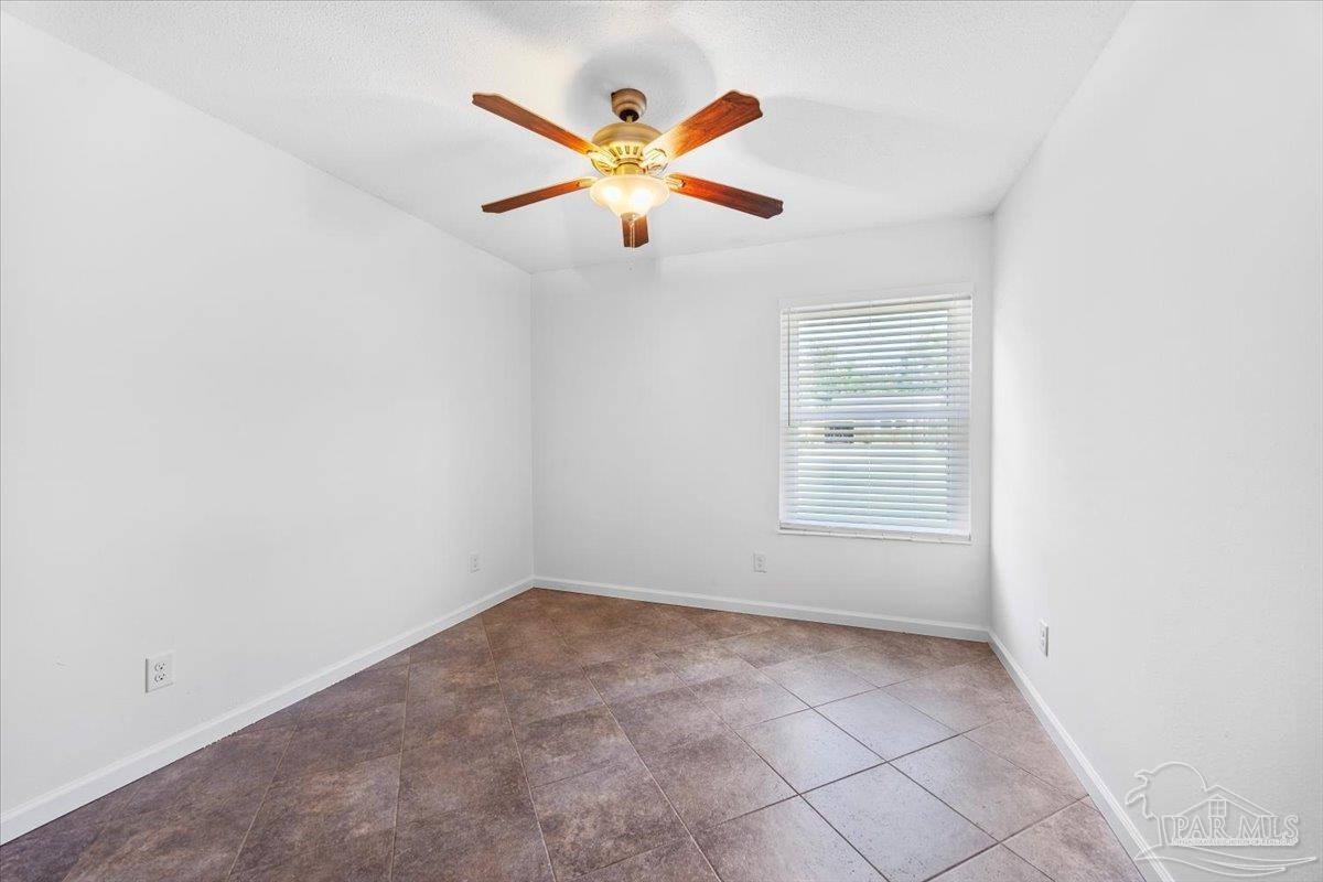 115 Bear Drive Gulf Breeze, FL 32561 - Photo 20 of 40 an empty room with closet and ceiling fan