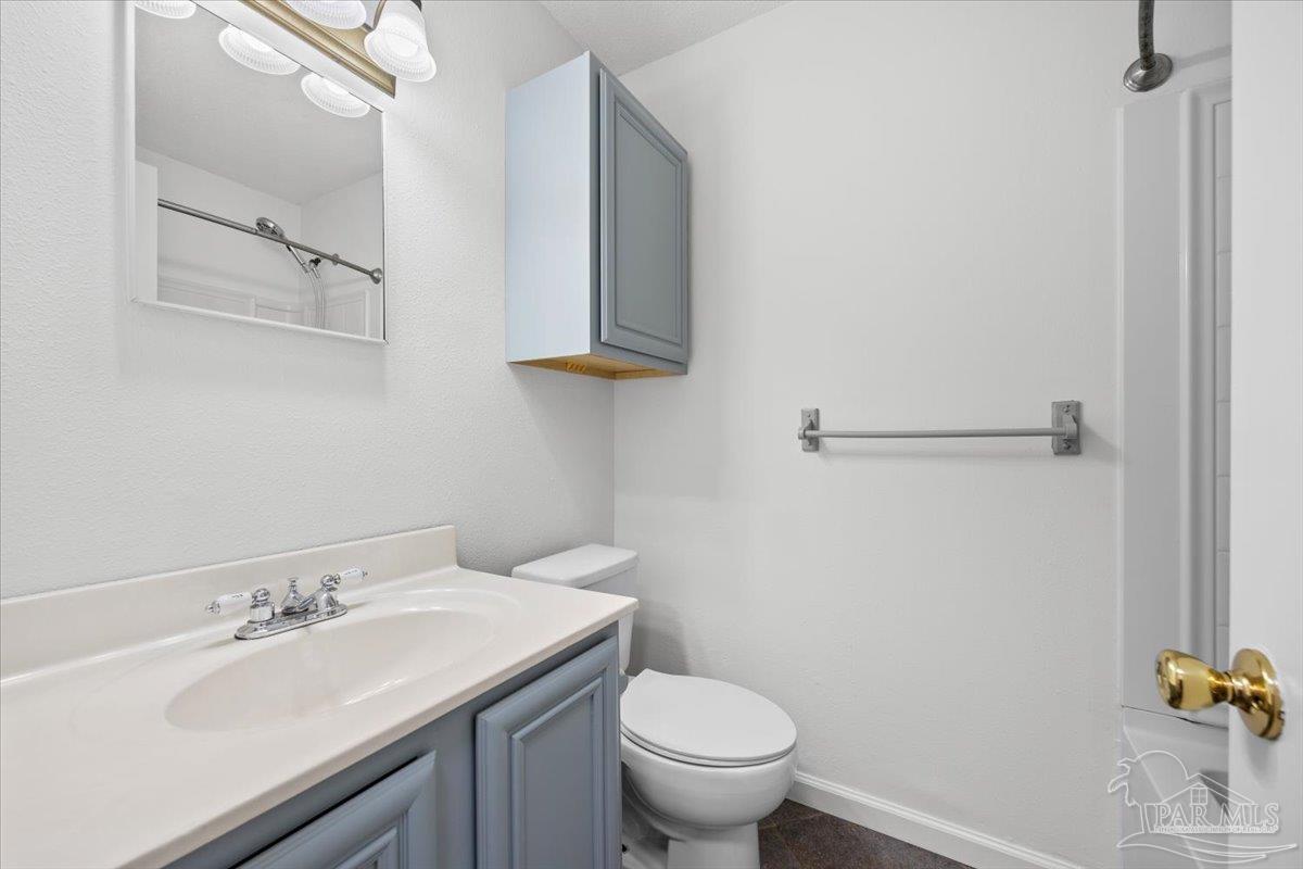115 Bear Drive Gulf Breeze, FL 32561 - Photo 23 of 40 a bathroom with a sink and a toilet