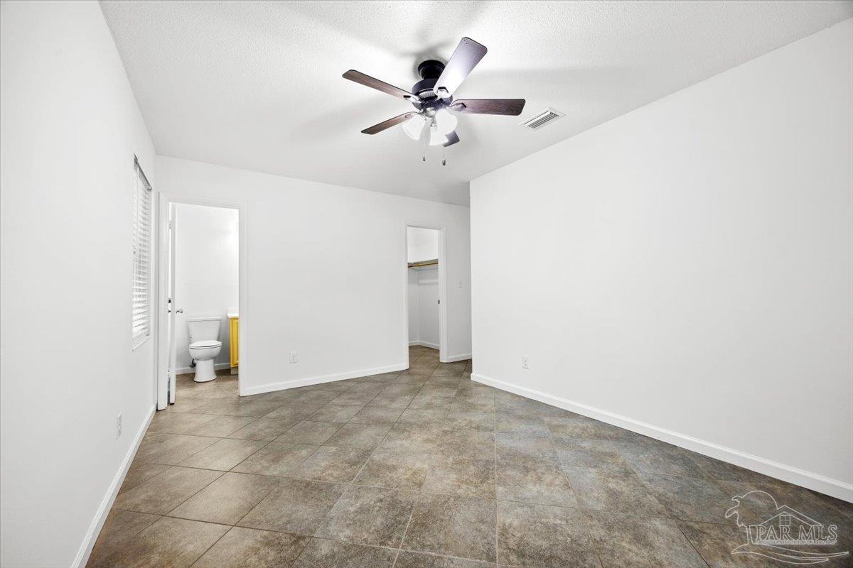 115 Bear Drive Gulf Breeze, FL 32561 - Photo 26 of 40 an empty room with closet and a ceiling fan