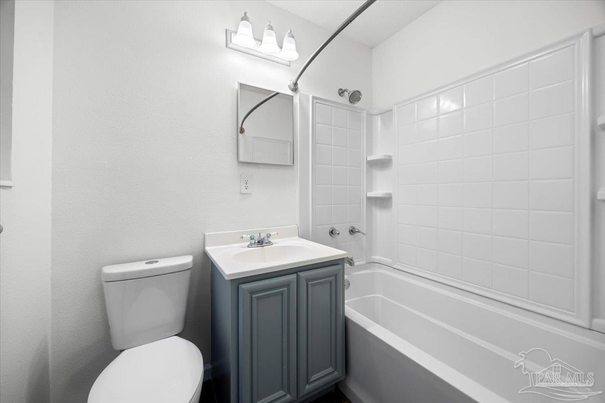 115 Bear Drive Gulf Breeze, FL 32561 - Photo 27 of 40 a bathroom with a toilet a sink and bathtub