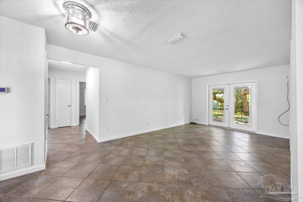 115 Bear Drive Gulf Breeze, FL 32561 - Photo 5 of 40 a view of a livingroom with an empty space and a window
