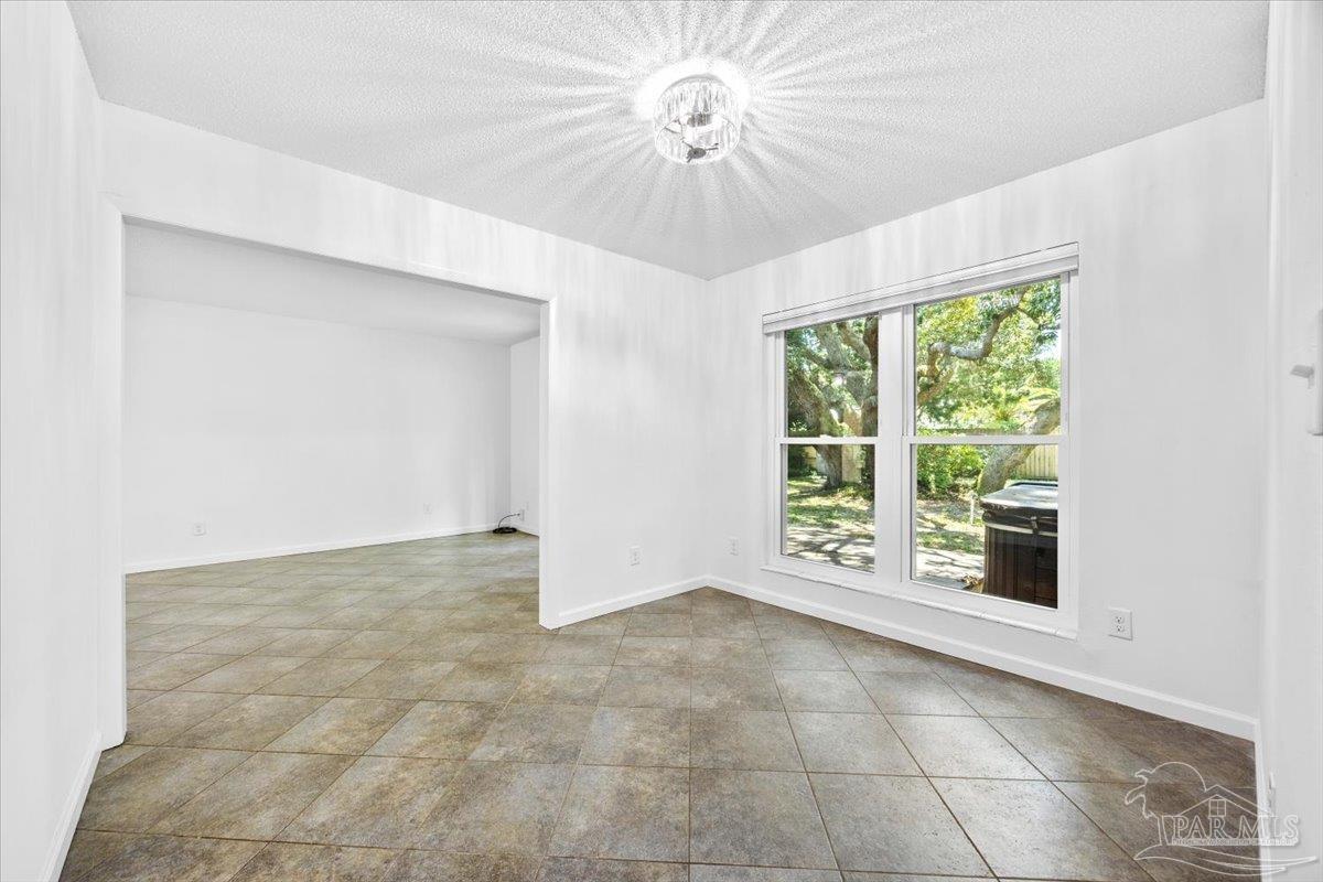 115 Bear Drive Gulf Breeze, FL 32561 - Photo 9 of 40 a view of an empty room with a window