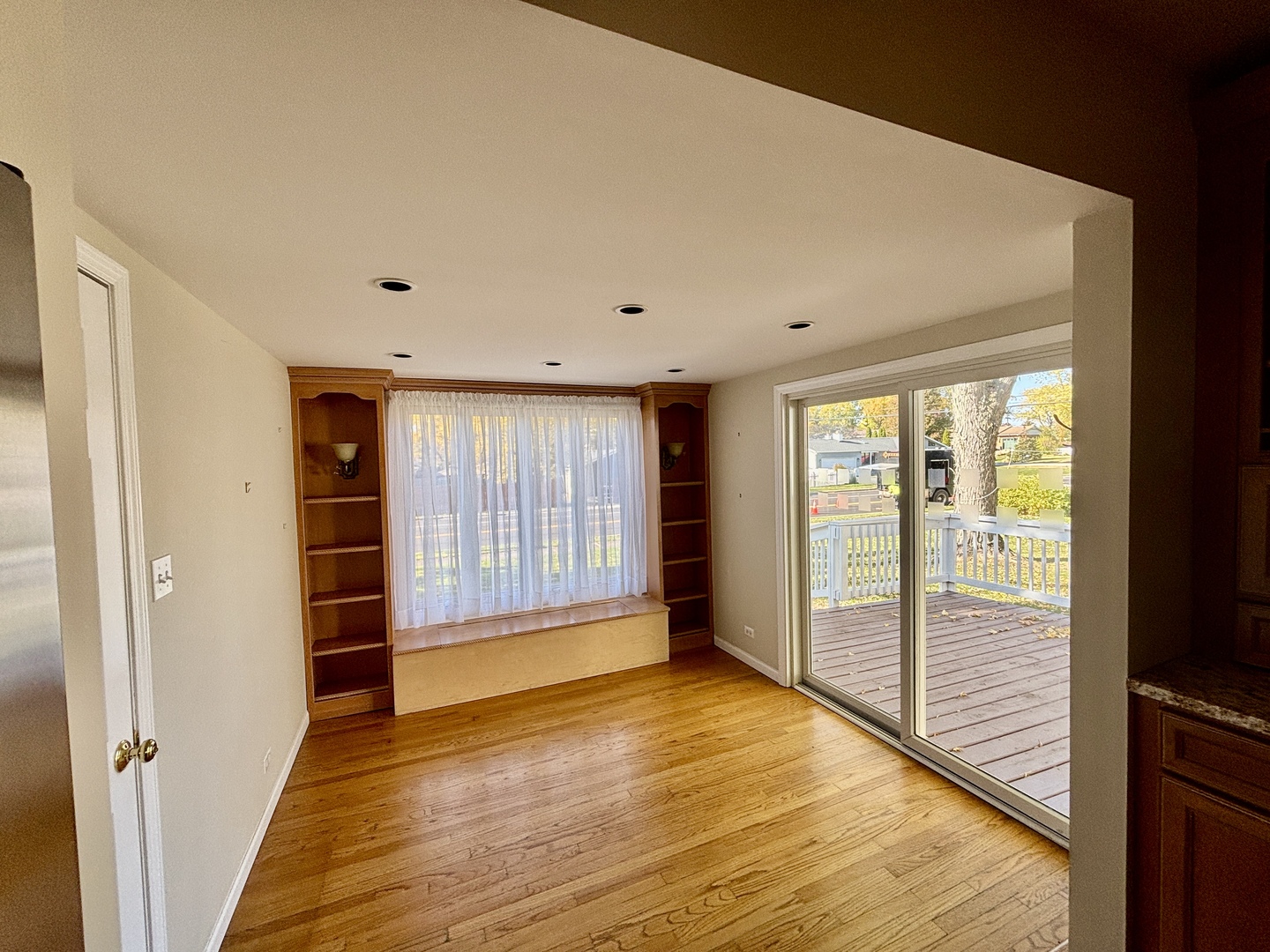 758 Maple Avenue Lisle, IL 60532 - Photo 11 of 31 a view of an empty room with wooden floor and a window