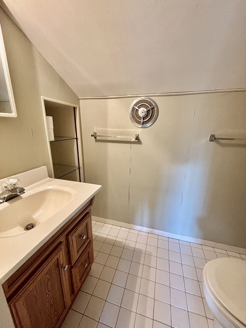 758 Maple Avenue Lisle, IL 60532 - Photo 23 of 31 a bathroom with a sink a toilet and a mirror