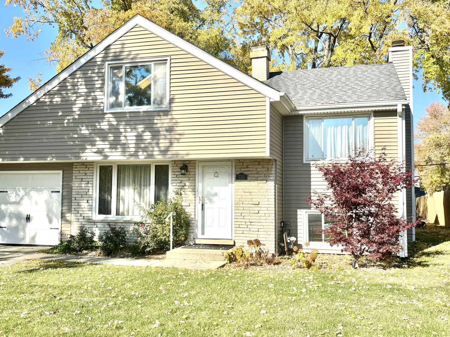 758 Maple Avenue Lisle, IL 60532 - Photo 3 of 31 a front view of a house with a yard and outdoor seating