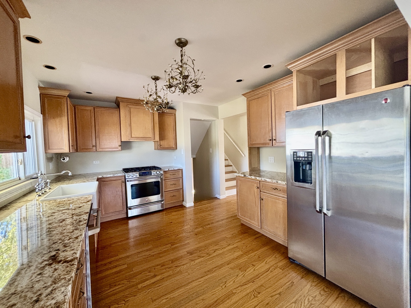758 Maple Avenue Lisle, IL 60532 - Photo 7 of 31 a kitchen with stainless steel appliances granite countertop a refrigerator a stove top oven and sink