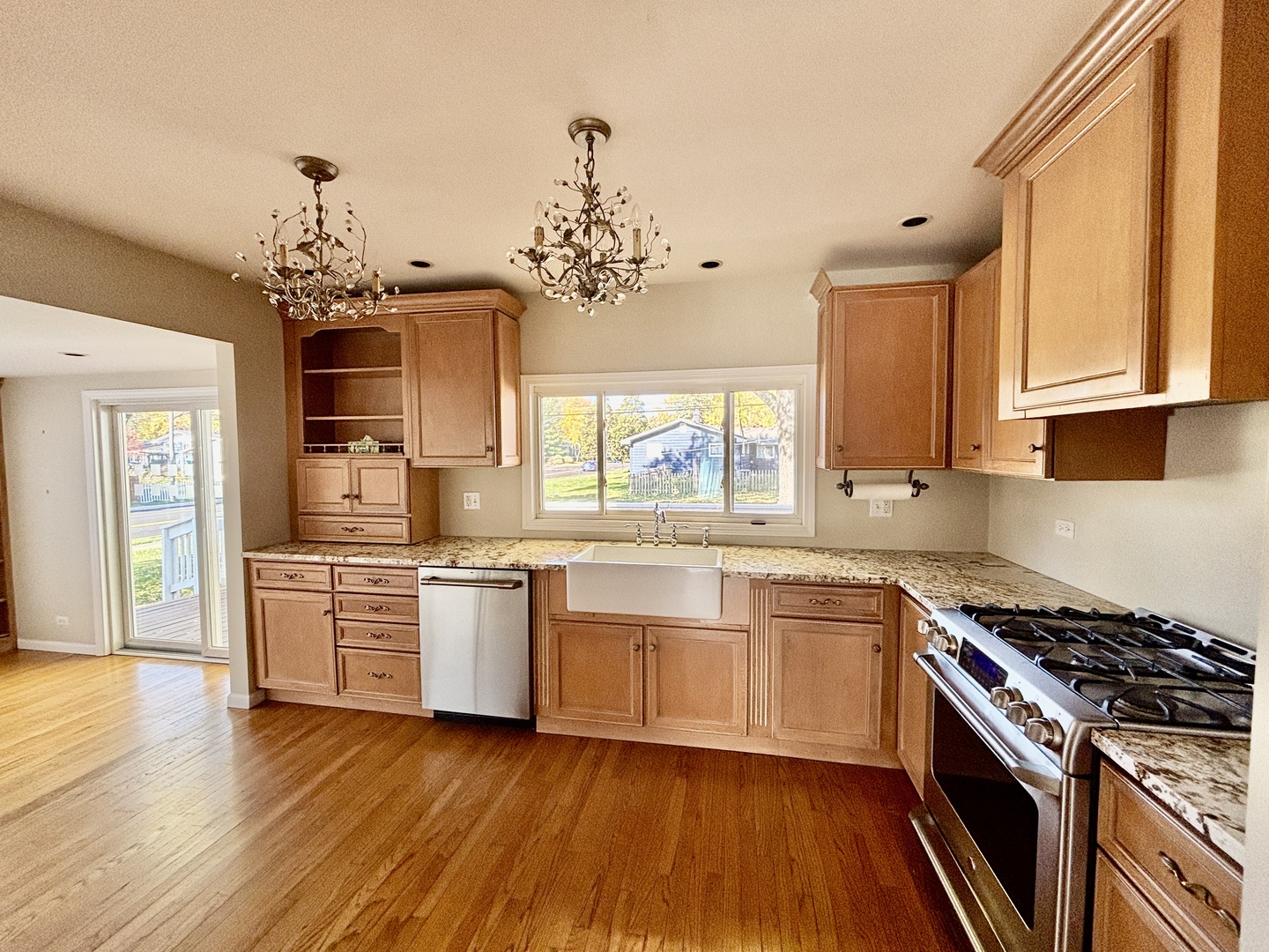 758 Maple Avenue Lisle, IL 60532 - Photo 8 of 31 a kitchen with stainless steel appliances wooden floors and a stove