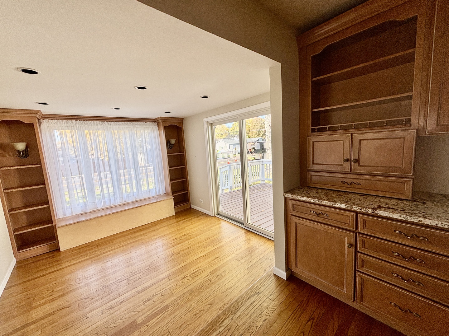 758 Maple Avenue Lisle, IL 60532 - Photo 10 of 31 a view of an empty room with wooden floor and a window