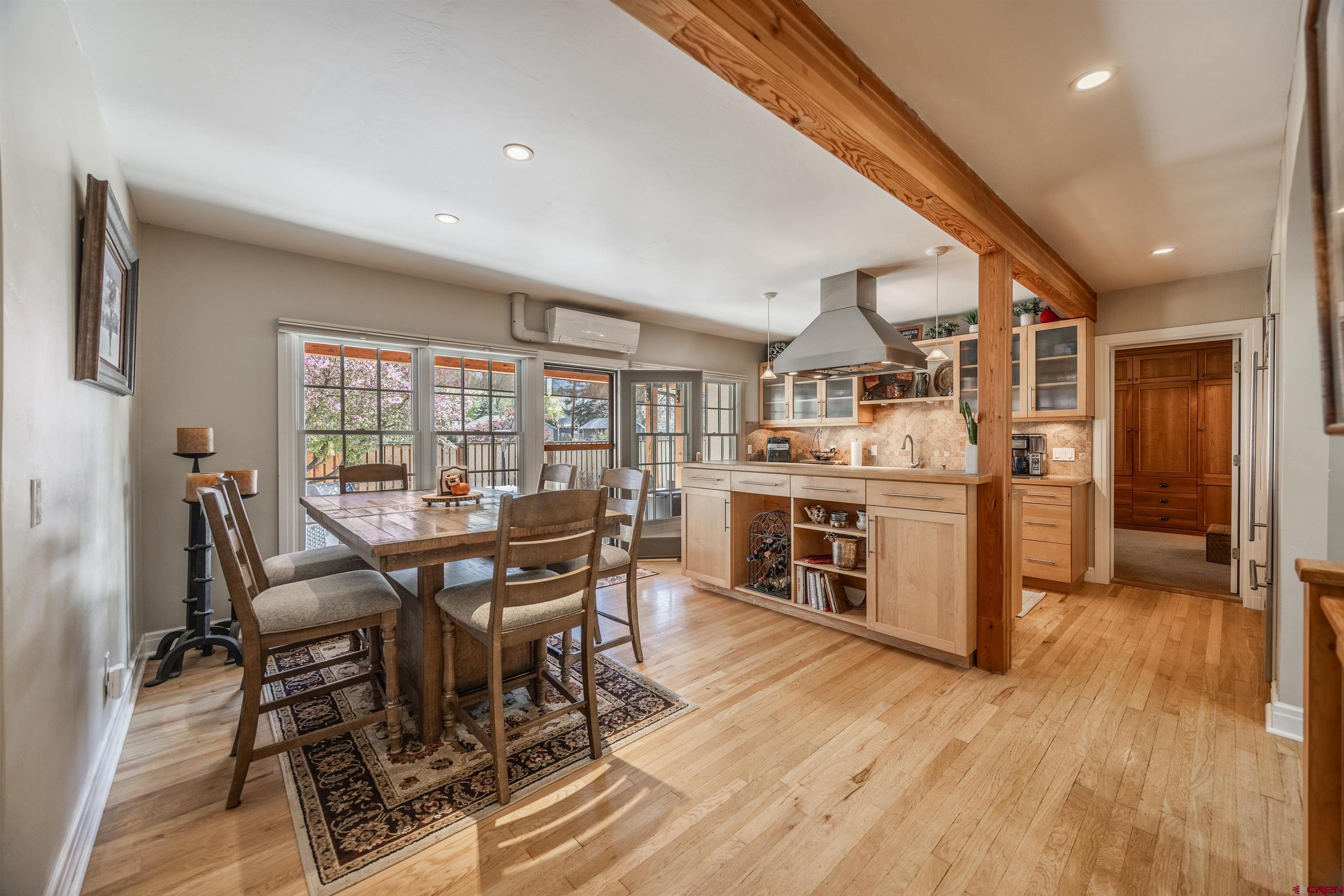 1146 South 2nd Street Montrose, CO 81401 - Photo 14 of 41 a view of a dining room with furniture and wooden floor