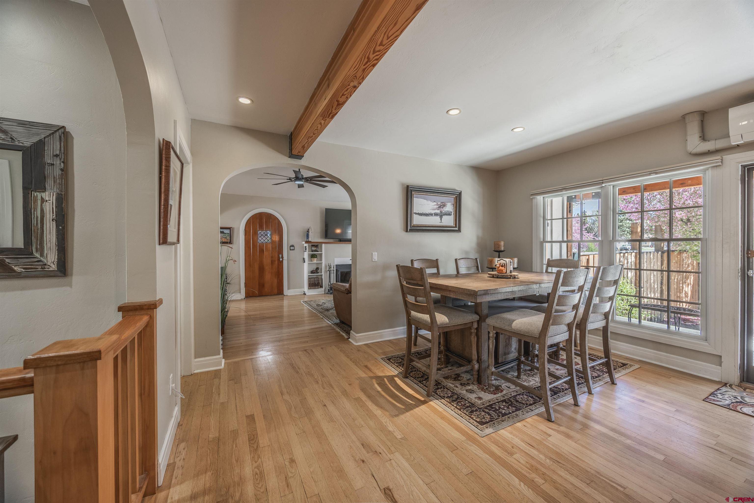 1146 South 2nd Street Montrose, CO 81401 - Photo 15 of 41 a view of a dining room with furniture window and wooden floor