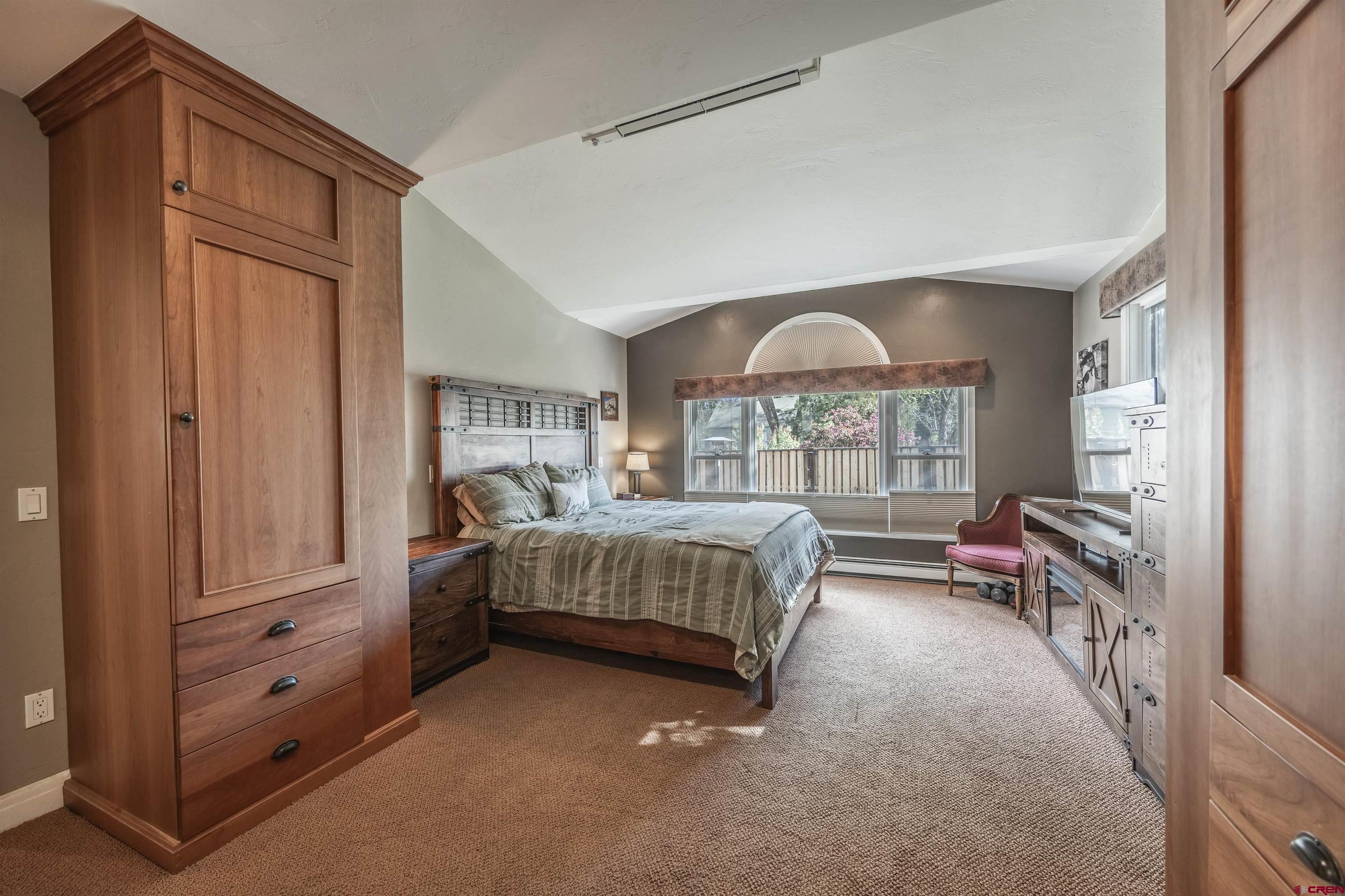 1146 South 2nd Street Montrose, CO 81401 - Photo 21 of 41 a spacious bedroom with a bed and a window
