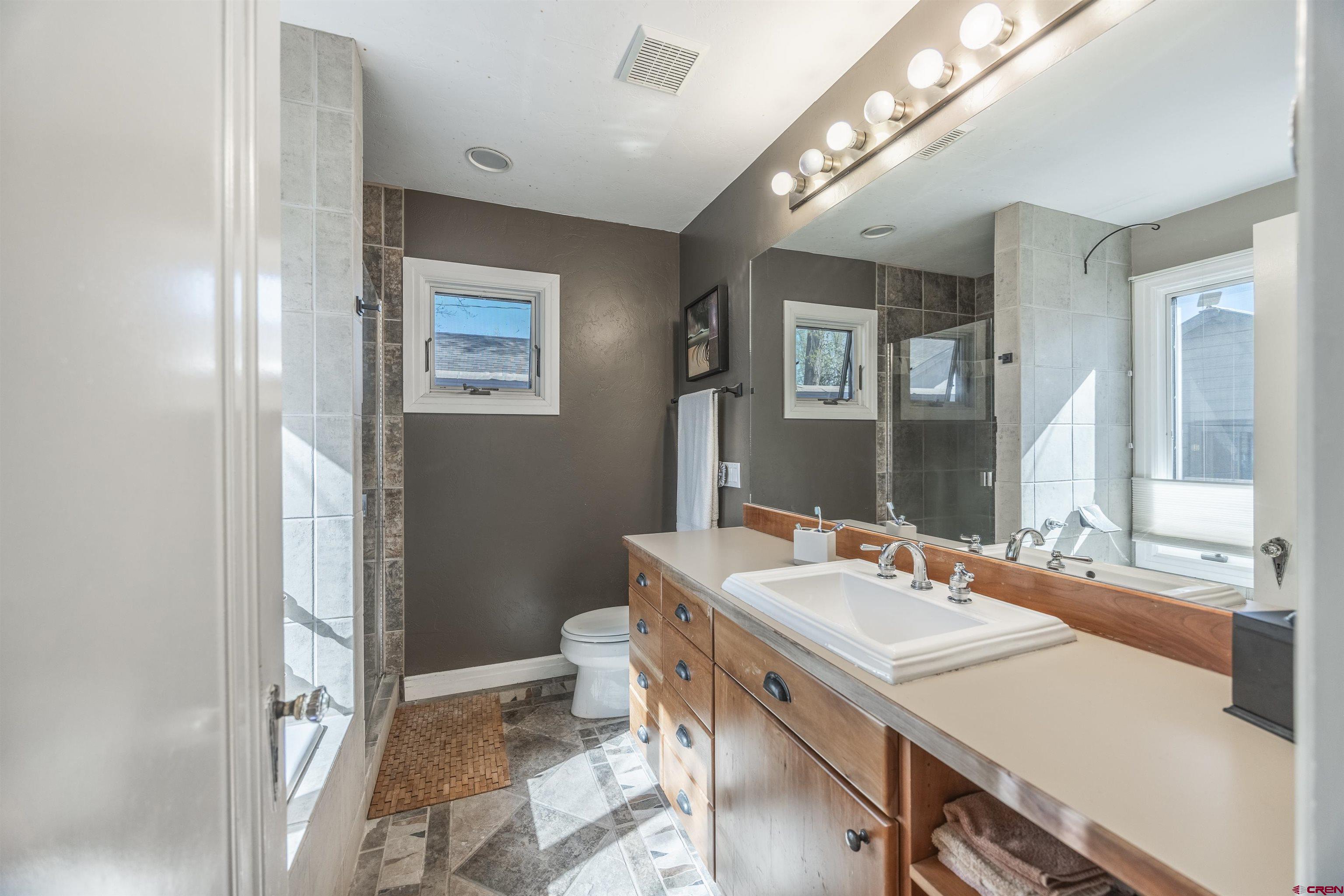 1146 South 2nd Street Montrose, CO 81401 - Photo 24 of 41 a bathroom with a sink and a mirror