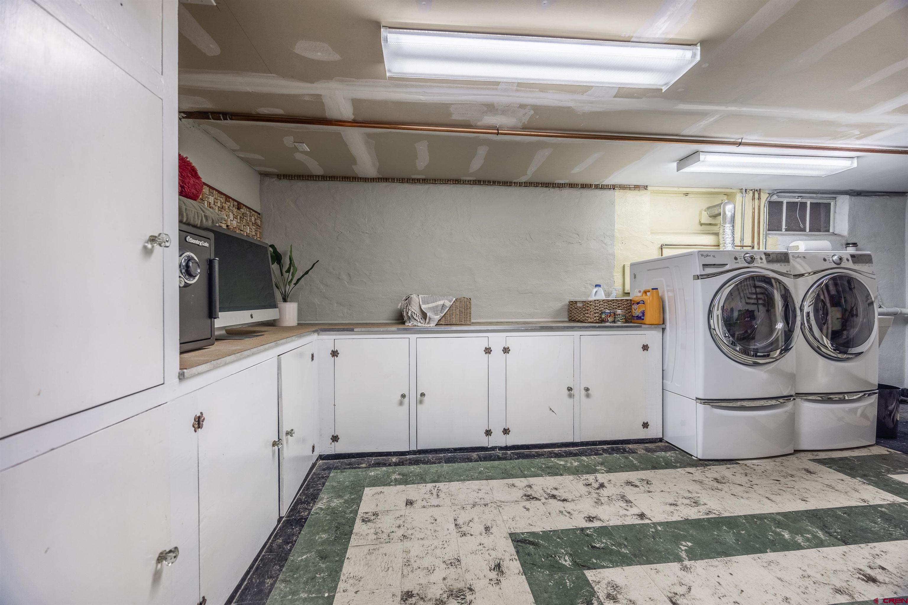 1146 South 2nd Street Montrose, CO 81401 - Photo 28 of 41 a utility room with cabinets