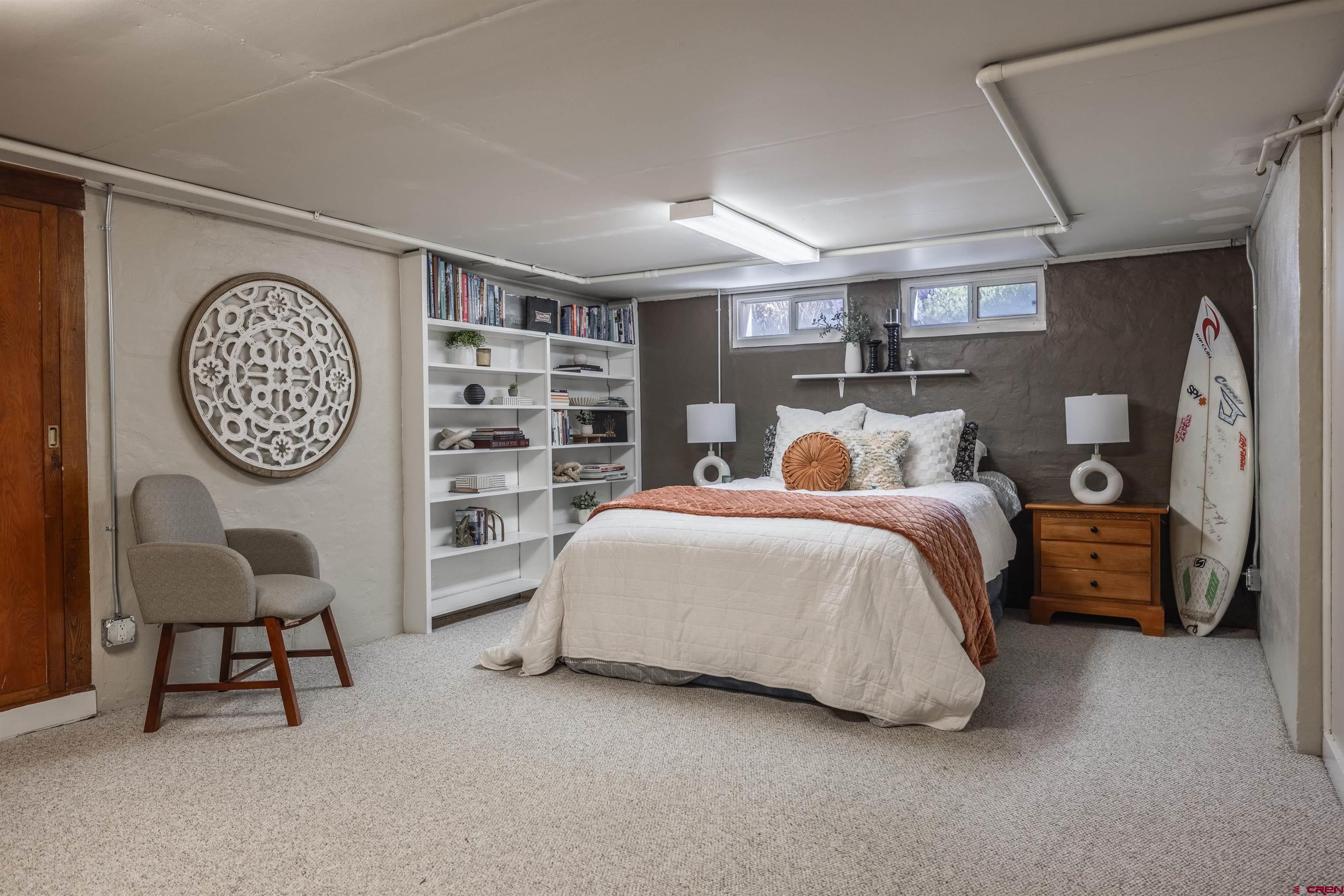 1146 South 2nd Street Montrose, CO 81401 - Photo 29 of 41 a bed room with a bed closet and a chair