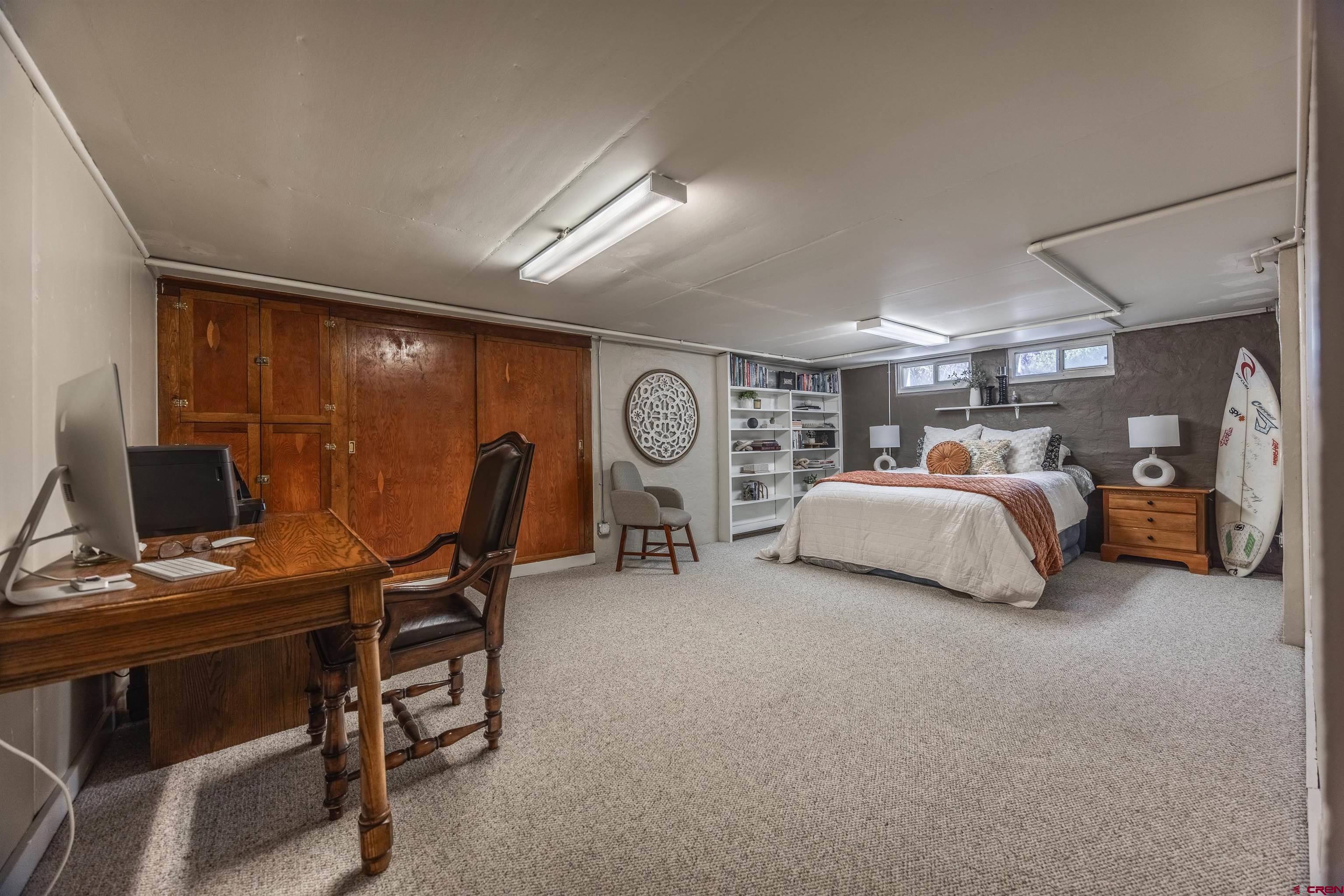 1146 South 2nd Street Montrose, CO 81401 - Photo 30 of 41 a bedroom with furniture and a bed