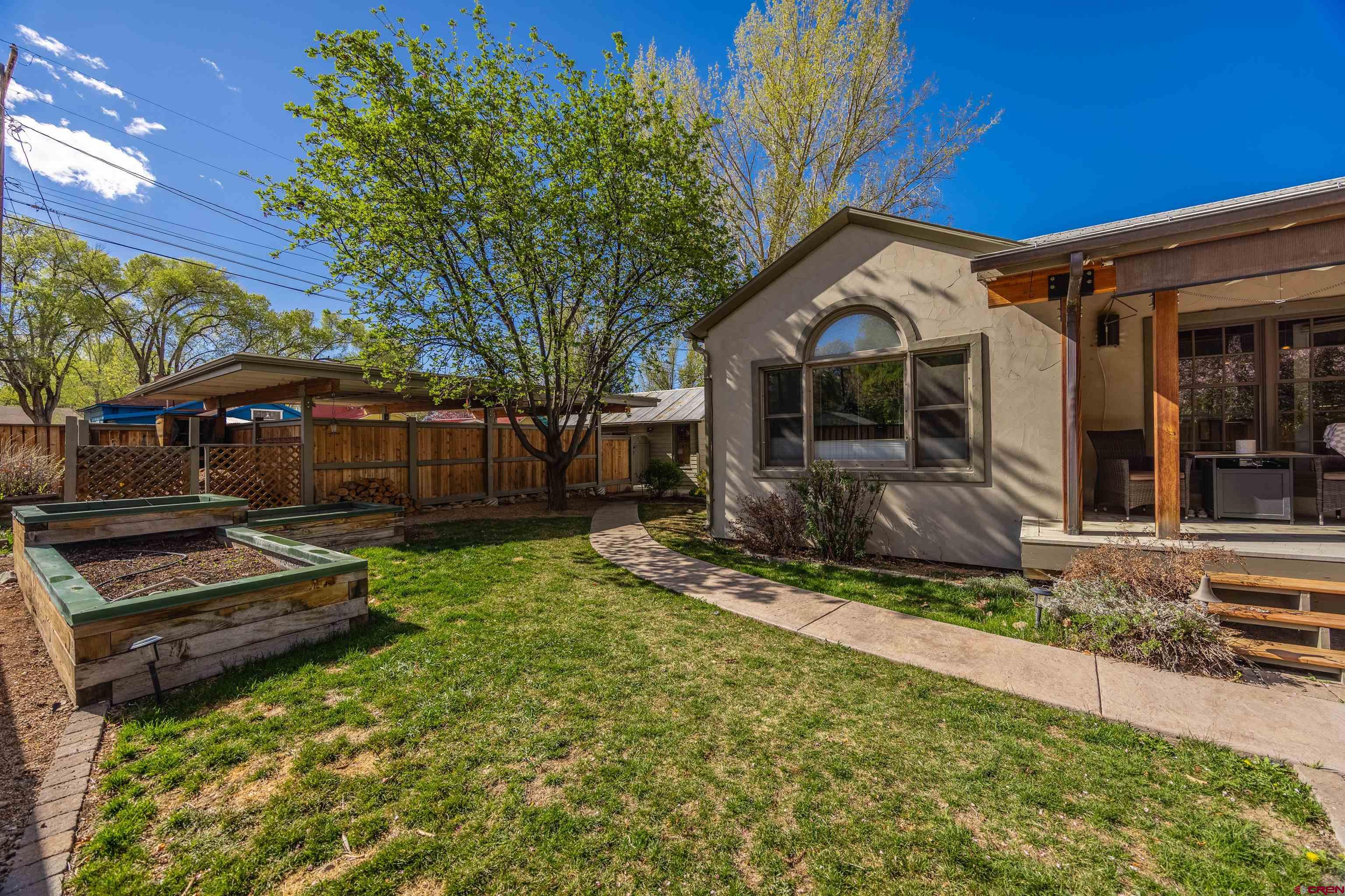 1146 South 2nd Street Montrose, CO 81401 - Photo 39 of 41 a view of a house with backyard and sitting area