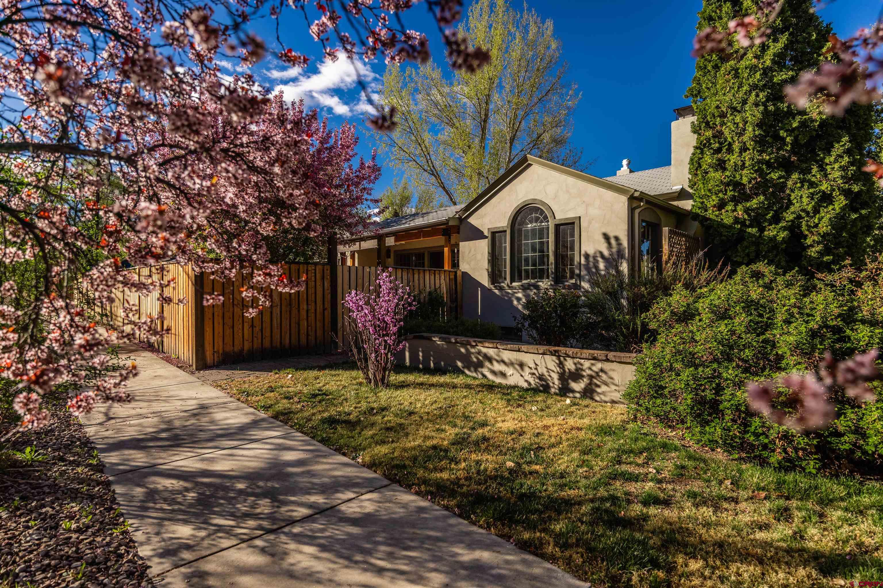 1146 South 2nd Street Montrose, CO 81401 - Photo 5 of 41 a view of a house with a yard