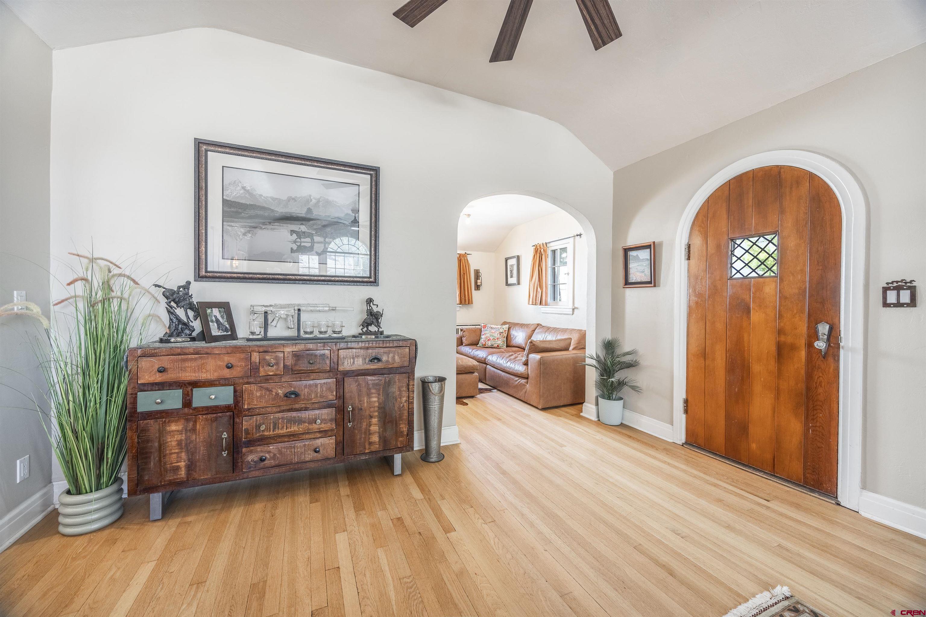 1146 South 2nd Street Montrose, CO 81401 - Photo 8 of 41 a living room with furniture and a wooden floor