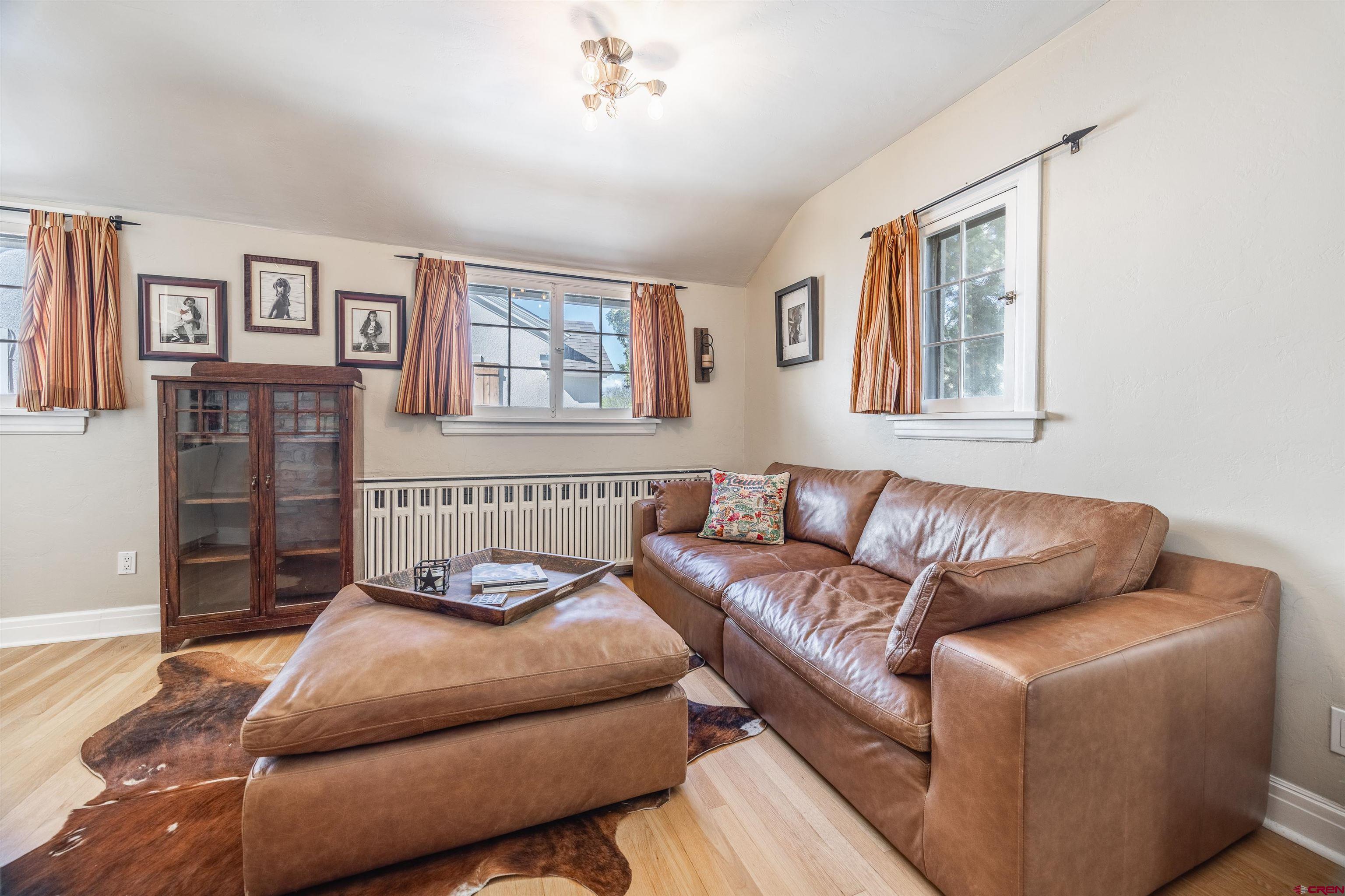 1146 South 2nd Street Montrose, CO 81401 - Photo 9 of 41 a living room with furniture and a window