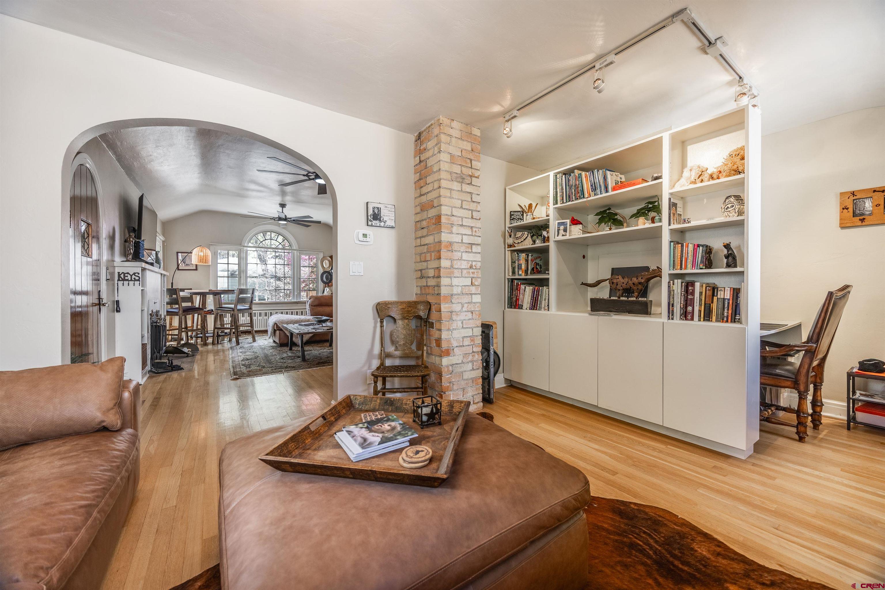 1146 South 2nd Street Montrose, CO 81401 - Photo 10 of 41 a living room with furniture and a wooden floor