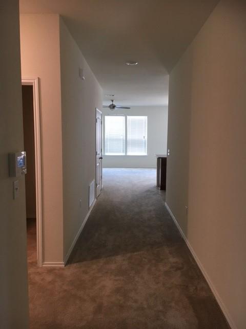 7700 Crystalbrook West Austin, TX 78724 - Photo 2 of 11 an empty room with windows