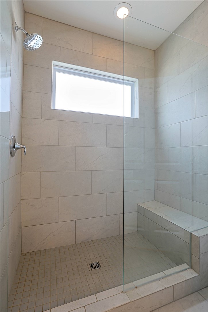 5013 Arena Court Hamilton, OH 45011 - Photo 24 of 41 This modern shower features elegant tile work and a convenient built-in bench for comfort and style.
