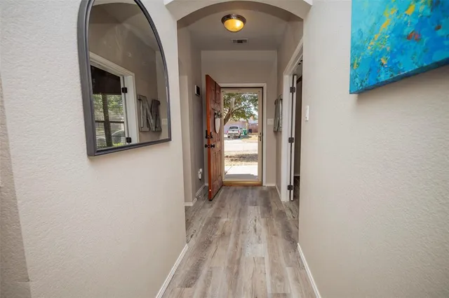 a view of a room that has a bench in it