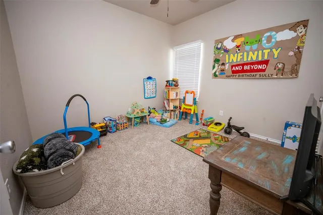a close view of a sink and a refrigerator in a kitchen