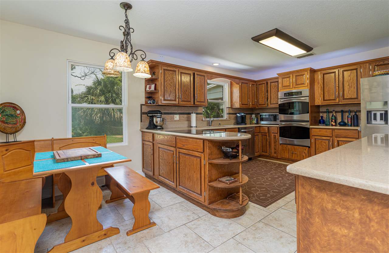 157 Ferrol Road St. Augustine, FL 32084 - Photo 14 of 40 a kitchen with cabinets a sink and appliances