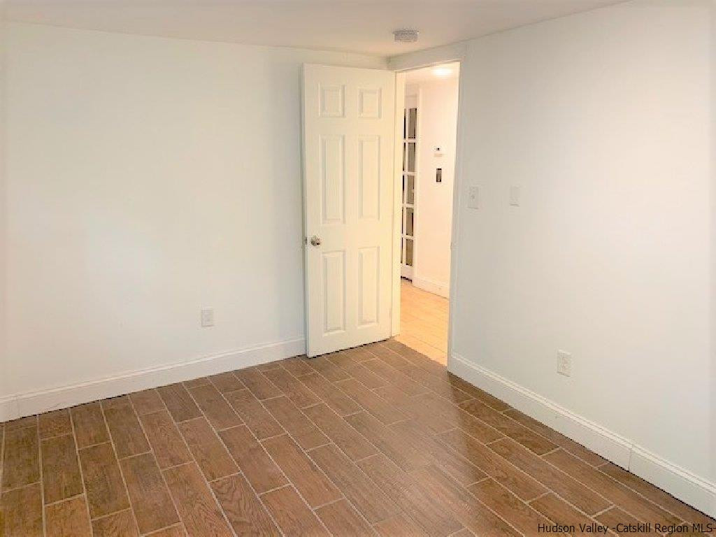 4 Colleen Lane Wallkill, NY 12589 - Photo 12 of 16 a view of an empty room with wooden floor