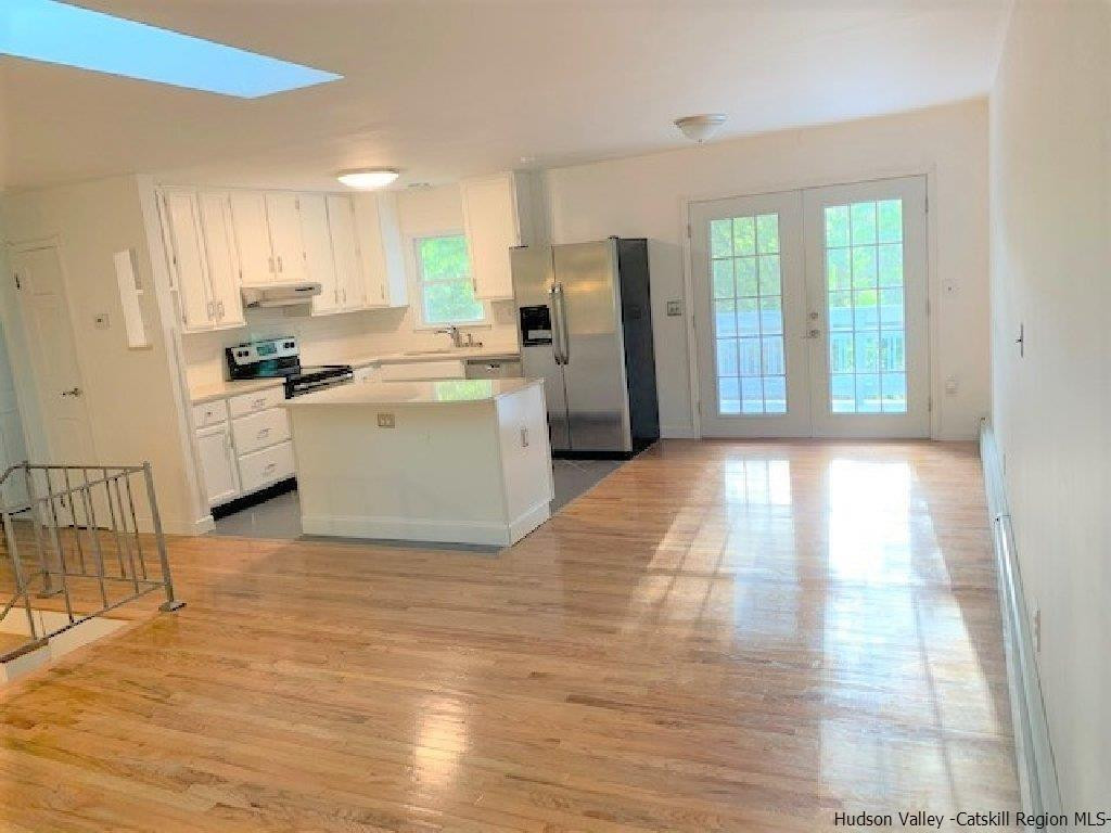 4 Colleen Lane Wallkill, NY 12589 - Photo 2 of 16 a kitchen with a refrigerator and a sink