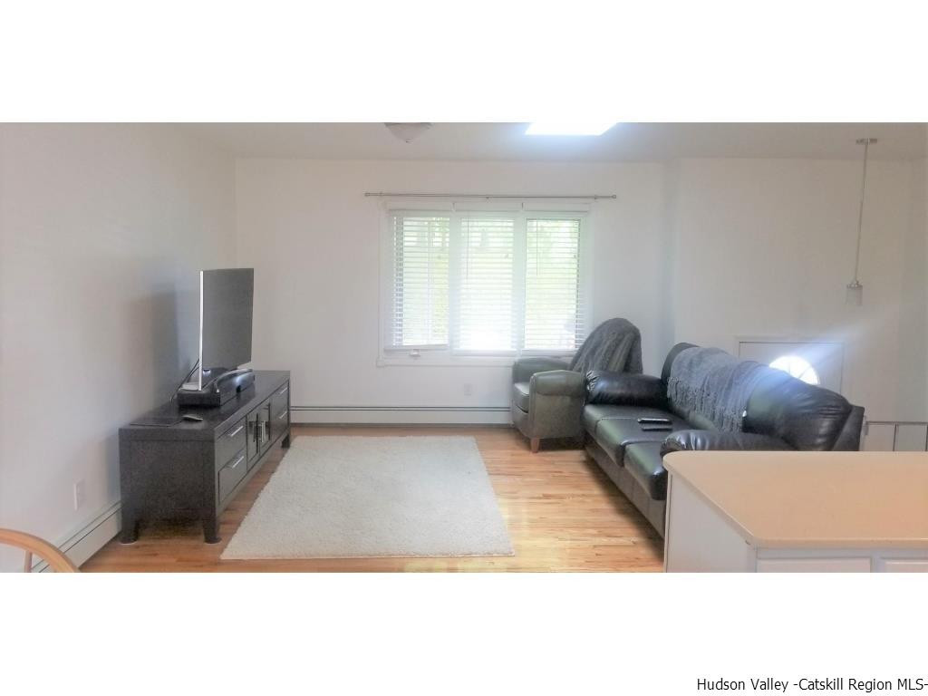 4 Colleen Lane Wallkill, NY 12589 - Photo 3 of 16 a living room with furniture a window and a couch