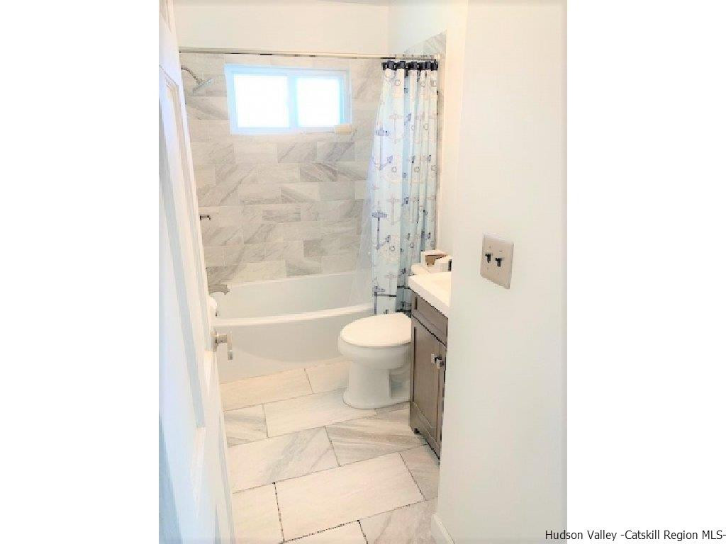 4 Colleen Lane Wallkill, NY 12589 - Photo 5 of 16 a bathroom with a toilet and a shower