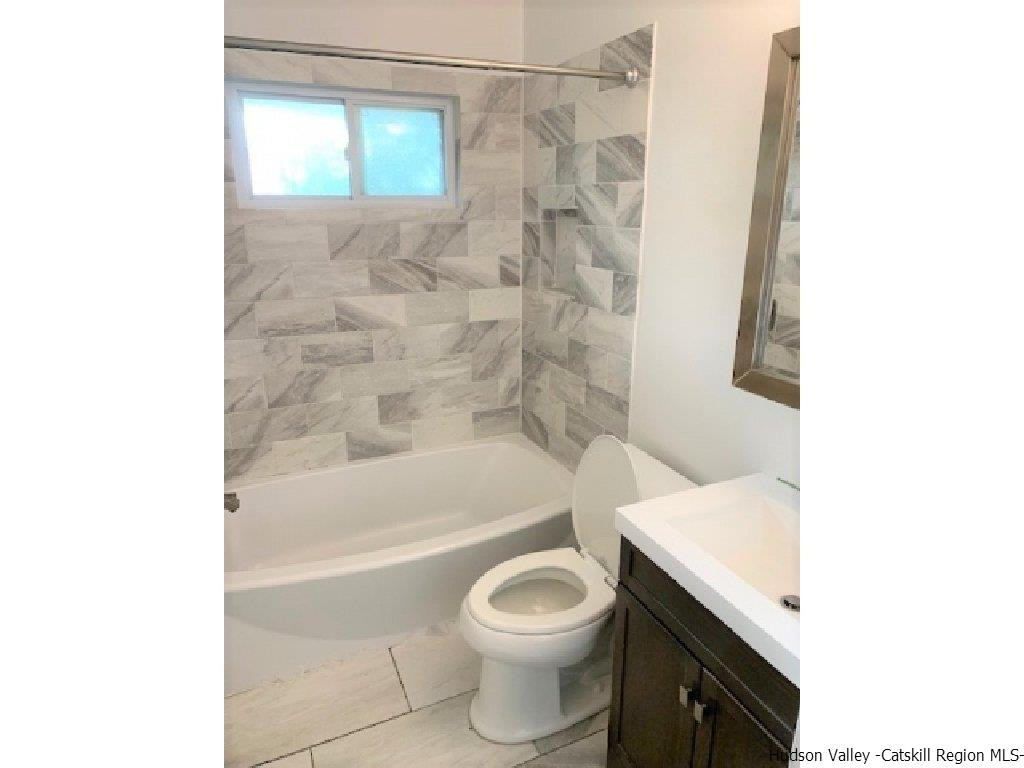 4 Colleen Lane Wallkill, NY 12589 - Photo 6 of 16 a bathroom with a toilet and a bathtub