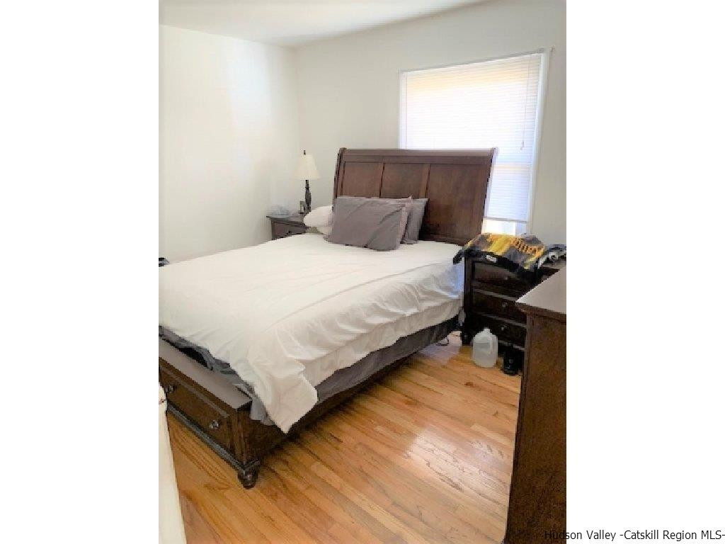 4 Colleen Lane Wallkill, NY 12589 - Photo 7 of 16 a bedroom with a bed and a window