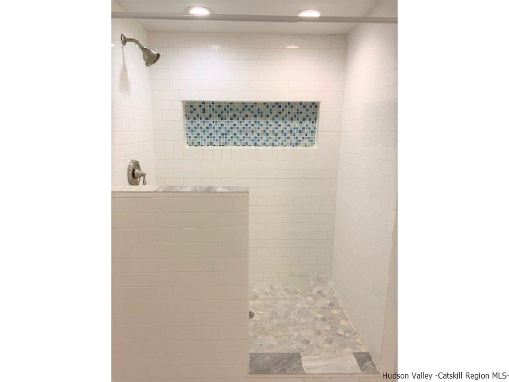 4 Colleen Lane Wallkill, NY 12589 - Photo 10 of 16 a bathroom with a shower and a sink
