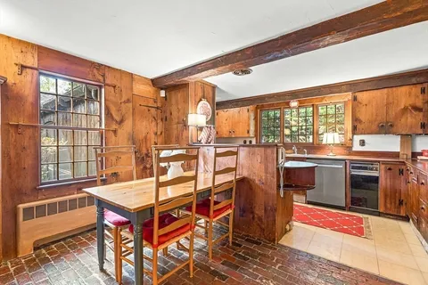 a view of a living room and kitchen with a large window