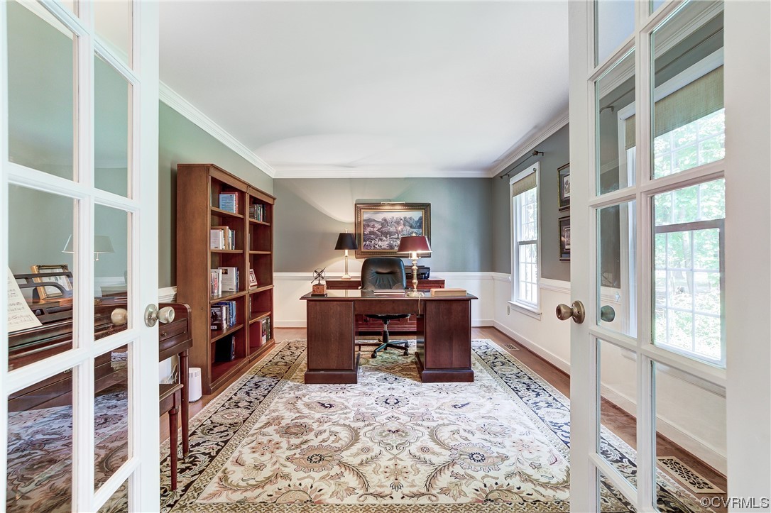 1920 Winterfield Road Midlothian, VA 23113 - Photo 13 of 26 a view of a workspace with furniture and a bookshelf