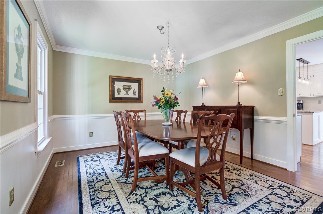 1920 Winterfield Road Midlothian, VA 23113 - Photo 14 of 26 a view of a dining room with furniture and wooden floor