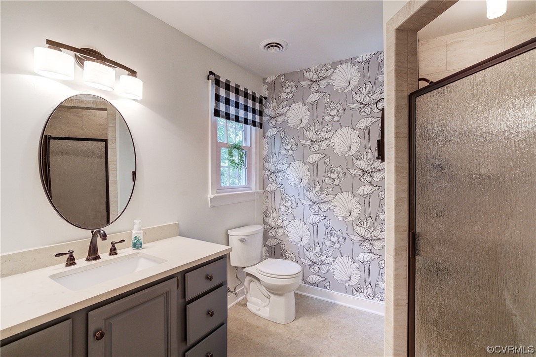 1920 Winterfield Road Midlothian, VA 23113 - Photo 16 of 26 a bathroom with a toilet a sink and a mirror