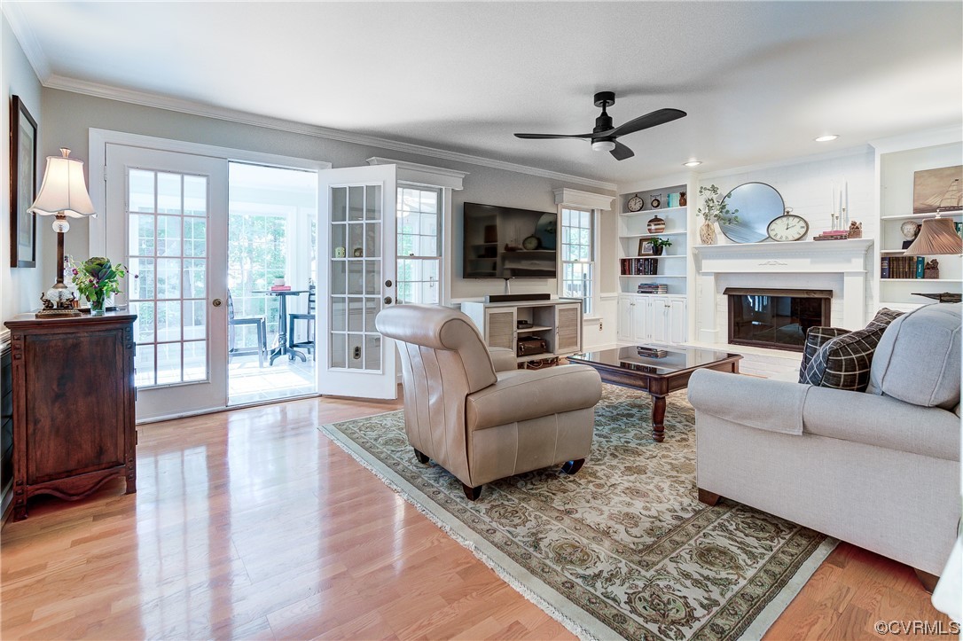 1920 Winterfield Road Midlothian, VA 23113 - Photo 4 of 26 a living room with furniture a flat screen tv and a fireplace