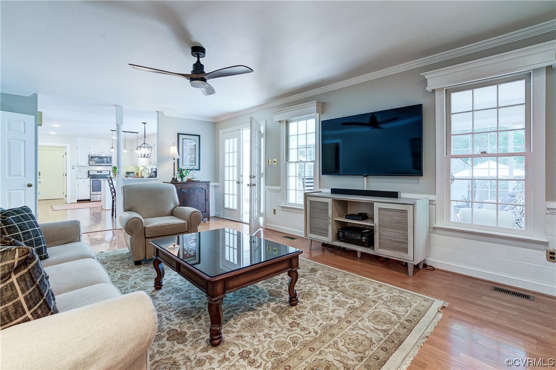1920 Winterfield Road Midlothian, VA 23113 - Photo 6 of 26 a living room with furniture a flat screen tv and a fireplace