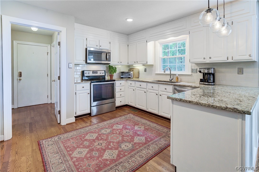 1920 Winterfield Road Midlothian, VA 23113 - Photo 7 of 26 a kitchen with granite countertop stainless steel appliances and sink