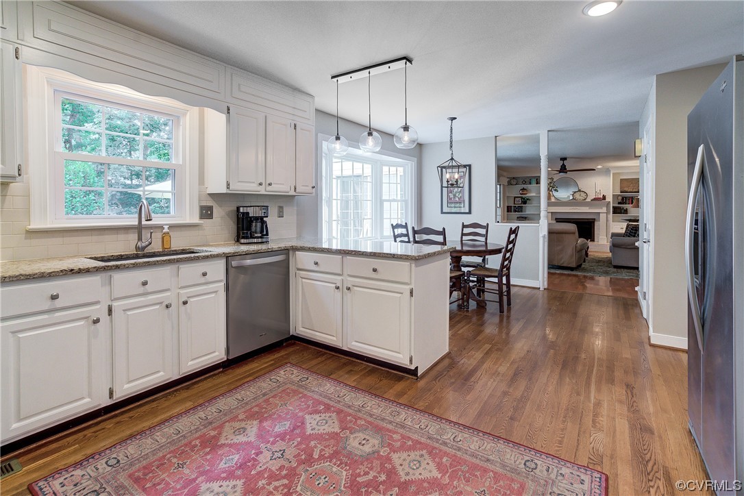 1920 Winterfield Road Midlothian, VA 23113 - Photo 8 of 26 a kitchen with a sink stove and cabinets