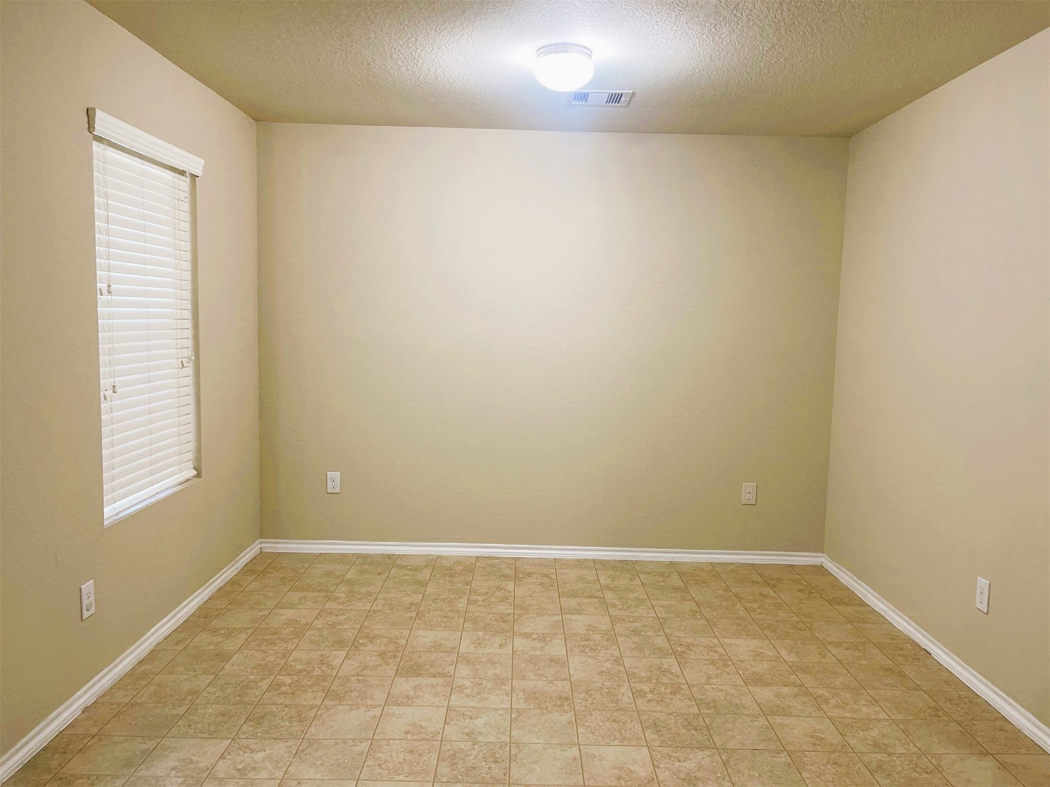 819 Katydid Court Conroe, TX 77301 - Photo 13 of 26 an empty room with windows