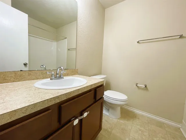 a bathroom with a sink and a toilet